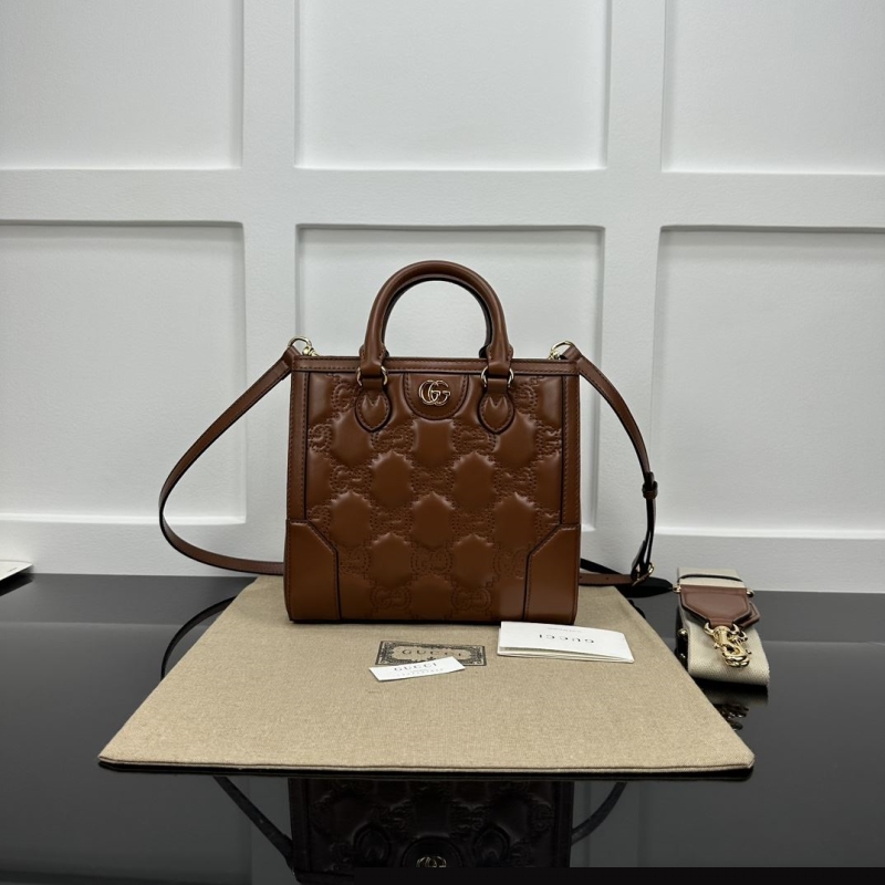 G*u*i top handle bags
